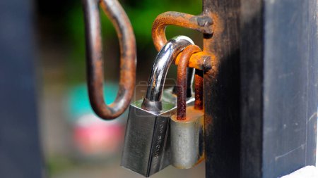 Photo for Old rusty padlock on the background of the house - Royalty Free Image