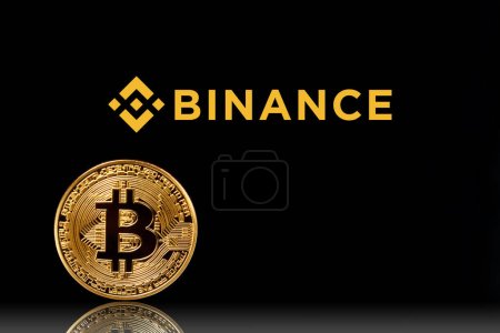 Photo for Binance logo with bitcoin on black background. Binance - one of the largest cryptocurrency exchange on the market. Moscow, Russia - November 1, 2022. - Royalty Free Image