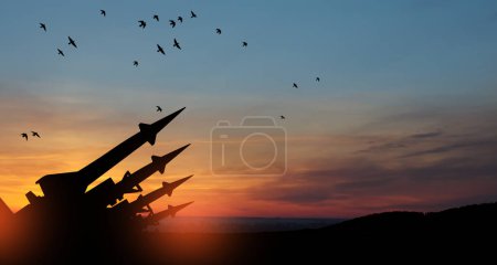 Photo for The missiles are aimed at the sky at sunset. Nuclear bomb, chemical weapons, missile defense, a system of salvo fire. - Royalty Free Image