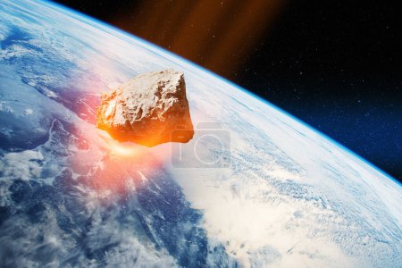 Foto de Planet Earth and big asteroid in the space. Potentially hazardous asteroids. Asteroid in outer space near Earth planet. Elements of this image furnished by NASA. - Imagen libre de derechos