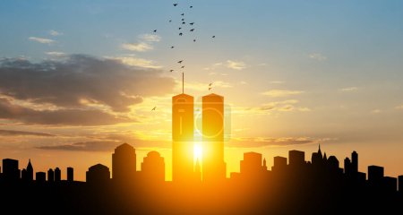 Téléchargez les photos : New York skyline silhouette with Twin Towers and birds flying up like souls at sunset. 09.11.2001 American Patriot Day banner. - en image libre de droit