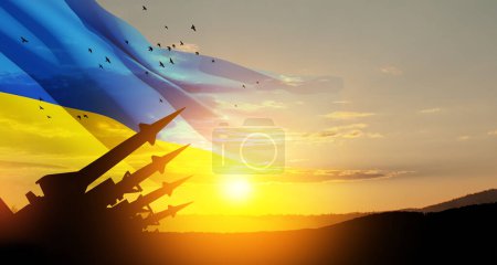 Photo for The missiles are aimed at the sky at sunset with Ukrainian flag. Nuclear bomb, chemical weapons, missile defense, a system of salvo fire. 3d-rendering. - Royalty Free Image
