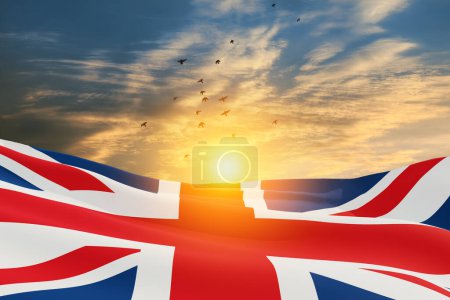 Photo for National flags of United Kingdom with flying birds on sunset sky background. Background with place for your text. 3d rendering. - Royalty Free Image