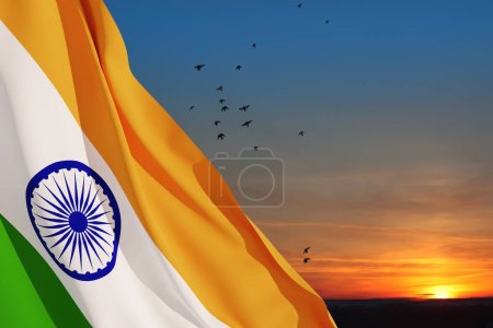 Photo for Waving India flag on sunset sky with flying birds. Background with place for your text. Indian independence day, 15 August. 3d-rendering. - Royalty Free Image
