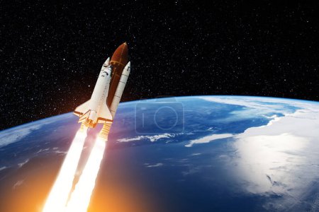 Foto de Spaceship lift off. Space shuttle with smoke and blast takes off into the starry sky. Rocket starts into space. Concept. Elements of this image furnished by NASA. - Imagen libre de derechos