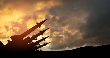 Photo for The missiles are aimed to the sky at sunset. Nuclear bomb, chemical weapons, missile defense, a system of salvo fire. - Royalty Free Image