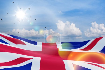 Téléchargez les photos : Drapeaux nationaux du Royaume-Uni avec des oiseaux volants sur fond bleu ciel. Contexte avec place pour votre texte. Rendu 3d. - en image libre de droit