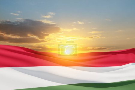 Photo for Waving flag of Hungary in sunset sky. Independence day, National day. Background with place for your text. - Royalty Free Image