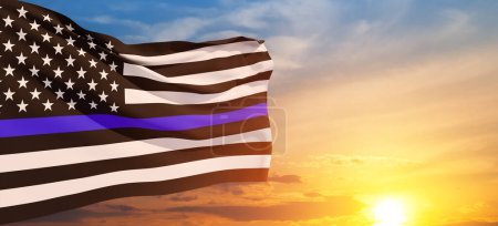 Foto de American flag with police support symbol Thin blue line on sunset sky. American police in society as the force which holds back chaos, allowing order and civilization to thrive. Banner. - Imagen libre de derechos