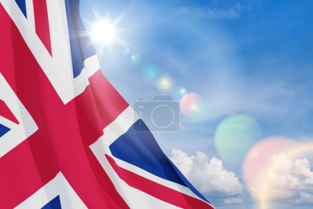 Téléchargez les photos : Drapeaux nationaux du Royaume-Uni sur fond bleu ciel. Contexte avec place pour votre texte. Rendu 3d. - en image libre de droit