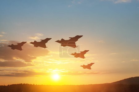 Photo for Air Force Day. Aircraft silhouettes on background of sunset or sunrise. - Royalty Free Image
