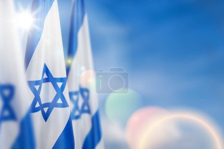 Israel flag with a star of David over cloudy sky background. Patriotic concept about Israel with national state symbols. Banner with place for text.