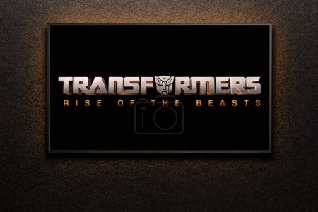 Photo for TV screen playing Transformers Rise of the Beasts trailer or movie. TV on black textured wall. Astana, Kazakhstan - May 15, 2023. - Royalty Free Image