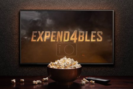 Photo for The expendables 4 trailer or movie on TV screen. TV with remote control and popcorn bowl. Astana, Kazakhstan - September 8, 2023. - Royalty Free Image