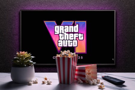 Photo for Grand Theft Auto 6 trailer game on TV screen. TV with remote control, popcorn boxes and home plant. Astana, Kazakhstan - December 5, 2023. - Royalty Free Image