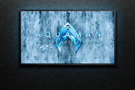 Photo for Aquaman and the Lost Kingdom trailer or movie on TV screen. TV on black textured wall. Astana, Kazakhstan - December 5, 2023. - Royalty Free Image