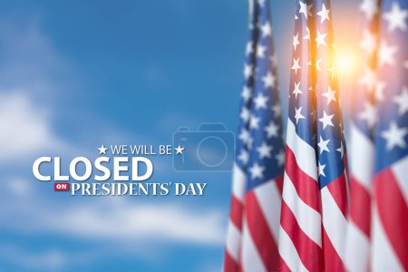Photo for Presidents Day Background Design. American flags on a background of blue sky with a message. We will be Closed on Presidents Day. - Royalty Free Image