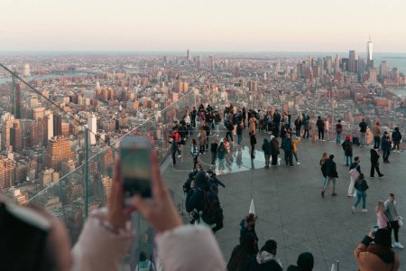 Photo for April, 30th 2022, New York: tourists admiring NY from The Edge, highest outdoor deck of the city - Royalty Free Image