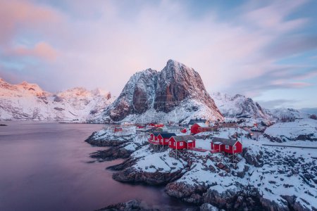 Famous Hamnoy fishing village on Lofoten Islands, Norway with red rorbu houses in winter.