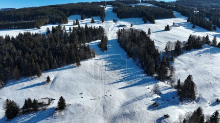 Photo for Aerial shot with a drone of a ski lift in Bavaria. Skiing in winter - Royalty Free Image