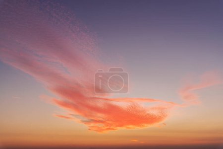 Dramatic colorful red orange to dark blue sunset or sunrise sky landscape clouds. Natural beautiful cloudscape dawn background wallpaper. Stormy windy nature twilight dusk scene panorama.