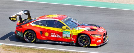 Photo for Oschersleben, Germany, May 28, 2023: Scenic motion blur view fast BMW M4 GT3 DTM at Oschersleben Motorsport Arena race track. European motors auto sport competition. - Royalty Free Image