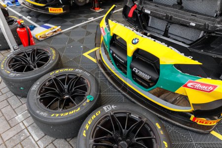 Photo for Oschersleben, Germany. 29th April, 2024. Sport racing Pirelli P zero tires wheels set ready mount paddock pits area motorsport race track. Stacked sports tyres supercar  circuit asphalt competition. - Royalty Free Image