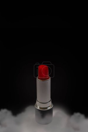 Photo for Red lipstick over black background with smoke, clouds and copy space - Royalty Free Image