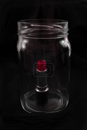 Photo for Red lipstick inside transparent jar with copy space - Royalty Free Image