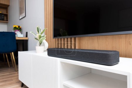 Soundbar in a modern home. Listening to music and watching movies