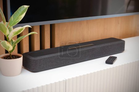 Soundbar in a modern home. Listening to music and watching movies