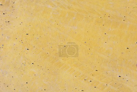 Foto de Vista superior de fondo texturizado de superficie lisa de color amarillo - Imagen libre de derechos