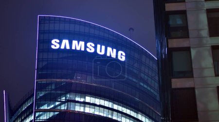 Warsaw, Poland. 23 November 2022. Evening city life in the centre of Warsaw.  Sign Samsung. Company signboard Samsung