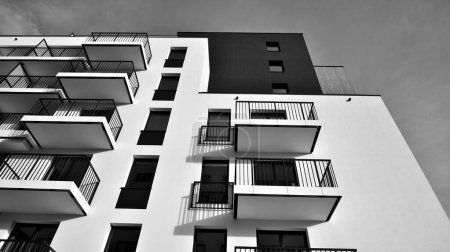 Photo for Apartments in residential complex. Housing structure at modern house.  Architecture for property investment. and architecture details. Urban abstract - windows of apartment building. Black and white. - Royalty Free Image