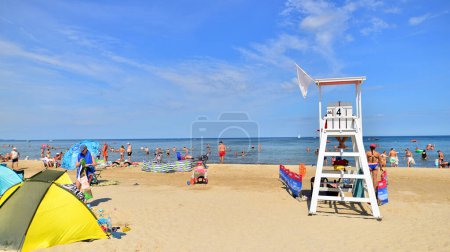 Photo for Swinoujscie, Poland. 15 August 2023. Lifeguards with rescue tower on the beach of the Baltic Sea - Royalty Free Image