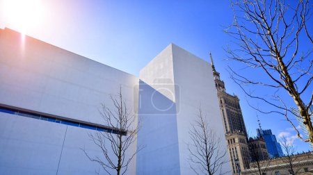 Photo for Sunlight and shadow on surface of white Concrete Building wall against blue sky background, Geometric Exterior Architecture in Minimal Street photography style - Royalty Free Image