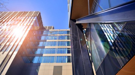 Photo for Steel and glass. The subject of modern architecture or construction industry. Modern office building facade with tall steel construction elements and full height windows between. - Royalty Free Image