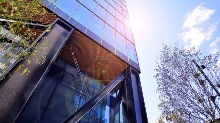 Photo for Steel and glass. The subject of modern architecture or construction industry. Modern office building facade with tall steel construction elements and full height windows between. - Royalty Free Image