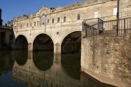 Photo for Bath, Somerset, United Kingdom - 7 February 2023: Historic Pulteney Bridge over the River Avon in Bath, Somerset, England - Royalty Free Image