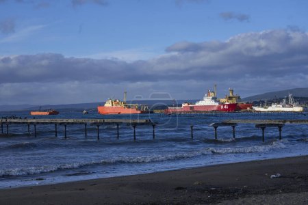 Photo for Punta Arenas, Chile - October 30, 2022: Waterfront along the Straight of Magellan in Punta Arenas, southern Chile. Ice ships docked at the pier. - Royalty Free Image