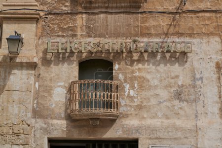 Photo for Valetta, Malta - June 8, 2023: Historic buildings lining narrow streets in the city of Valetta in Malta - Royalty Free Image
