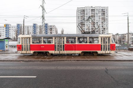 Photo for Old red Tatra T3 tram in the cloudy day in the city. Kyiv, Ukraine - December 15, 2020. - Royalty Free Image