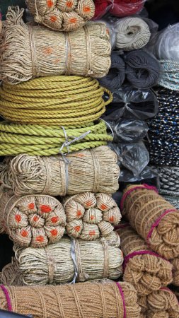 Photo for Various types of rope and cord on sale making a colourful display in the market at Jodhpur in Rajasthan, India - Royalty Free Image