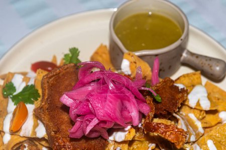 Typical mexican chilaquiles with yucatecan pork