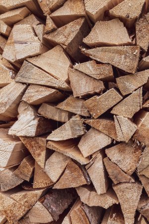 Photo for Wood texture. Logs on top of each other. Village woodshed. Wood for heating the house. Christmas background. - Royalty Free Image