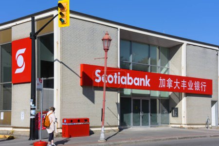 Photo for Ottawa, Canada - October 22, 2022: The Scotiabank, or Bank of Nova Scotia, in Chinatown area of Ottawa, featuring Chinese and English writing. Scotiabank is one of Canada's Big Five banks and operates in many countries around the world. - Royalty Free Image
