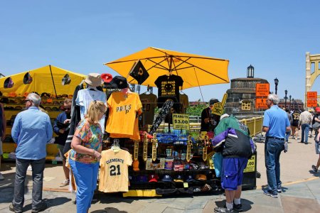 Photo for Pittsburgh, PA, USA- May 21, 2023: Stands selling Pirates merchandise set up at start of bridge that takes fans to the PNC Park to watch the Pittsburgh Pirates play baseball. - Royalty Free Image
