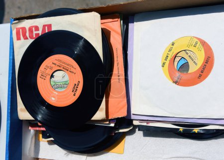 Photo for Ottawa, Canada - May 27, 2023: 45 rpm 7" vinyl single records at the  annual Glebe neighborhood garage sale which takes place for several blocks in the Glebe area of Ottawa, Ontario. - Royalty Free Image