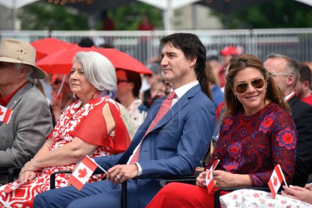 Photo for Ottawa, Canada July 1, 2023: Governor General Mary Simon and Prime Minister Justin Trudeau, with his wife Sophie Grgoire Trudeau to the left, attend the Canada Day celebration at LeBreton Flats. Simon is Inuk and the first Indigenous person to be GG - Royalty Free Image