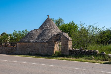 Photo for Old traditional stone Trullo building in Puglia in southern Italy - Royalty Free Image